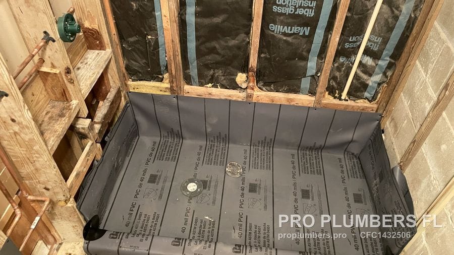 40 mil PVC shower pan liner installed over a framed shower base with drain opening in Land O' Lakes, Florida by PRO PLUMBERS FL, LLC (licence CFC1432506)