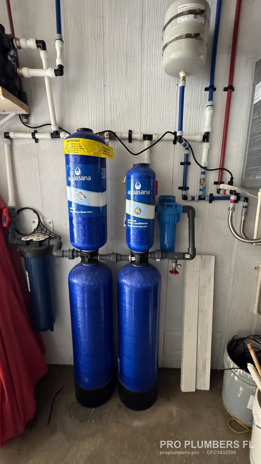 Aquasana whole-house filter and salt-free conditioner tanks with blue prefilter and expansion tank in Englewood, Florida by PRO PLUMBERS FL, LLC (licence CFC1432506)