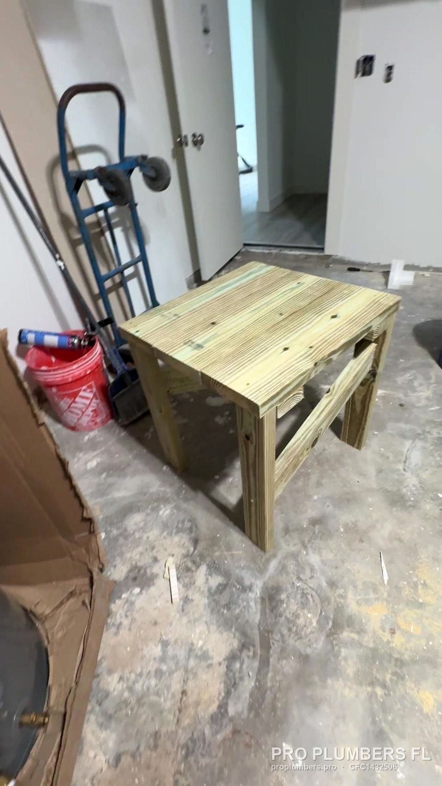 Custom pressure-treated lumber stand built on site for a water heater in Belleair Beach, Florida by PRO PLUMBERS FL, LLC (licence CFC1432506)