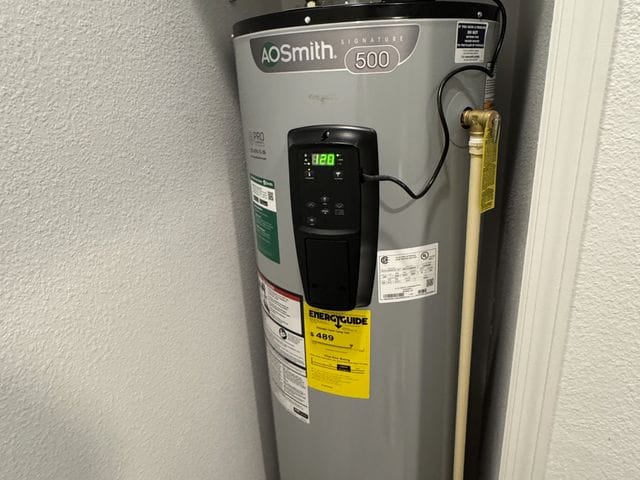 Electric tank water heater with expansion tank fitted into a narrow closet in Clearwater, Florida by PRO PLUMBERS FL, LLC (licence CFC1432506)