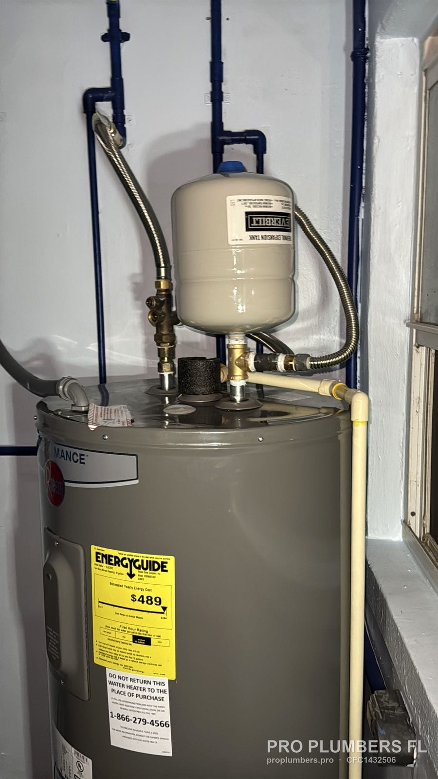 Electric tank water heater with expansion tank and PEX supply lines in a utility closet in St. Pete Beach, Florida by PRO PLUMBERS FL, LLC (licence CFC1432506)