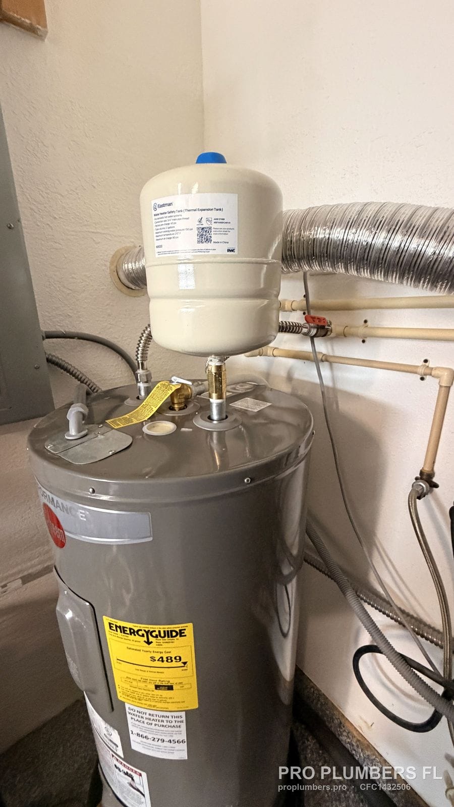 Electric tank water heater with expansion tank in a utility room in St. Petersburg, Florida by PRO PLUMBERS FL, LLC (licence CFC1432506)