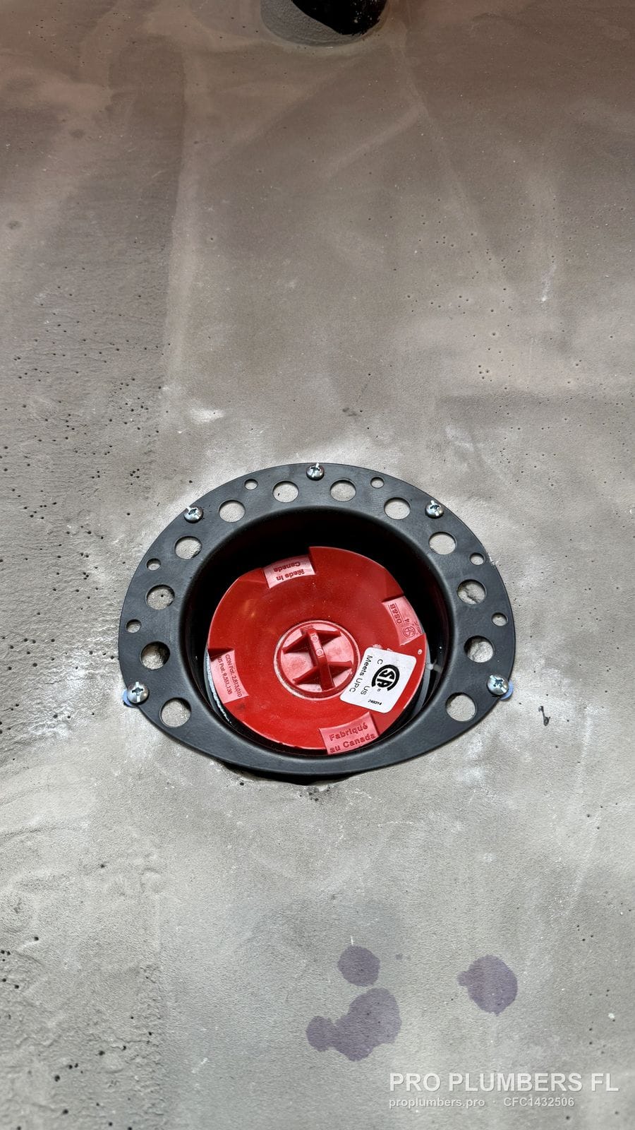 Freestanding tub drain rough-in with test cap set in a concrete slab before flooring in Westchase, Florida by PRO PLUMBERS FL, LLC (licence CFC1432506)