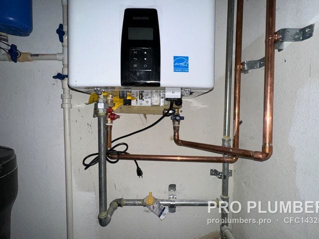 Wall-mounted gas tankless water heater with copper water piping and gas shutoff in Largo, Florida by PRO PLUMBERS FL, LLC (licence CFC1432506)