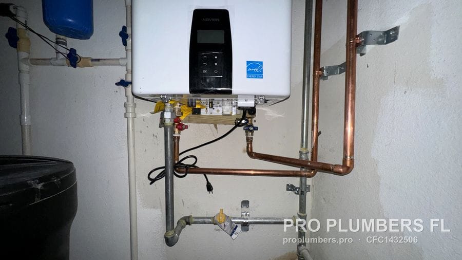 Wall-mounted gas tankless water heater with copper water piping and gas shutoff in Largo, Florida by PRO PLUMBERS FL, LLC (licence CFC1432506)