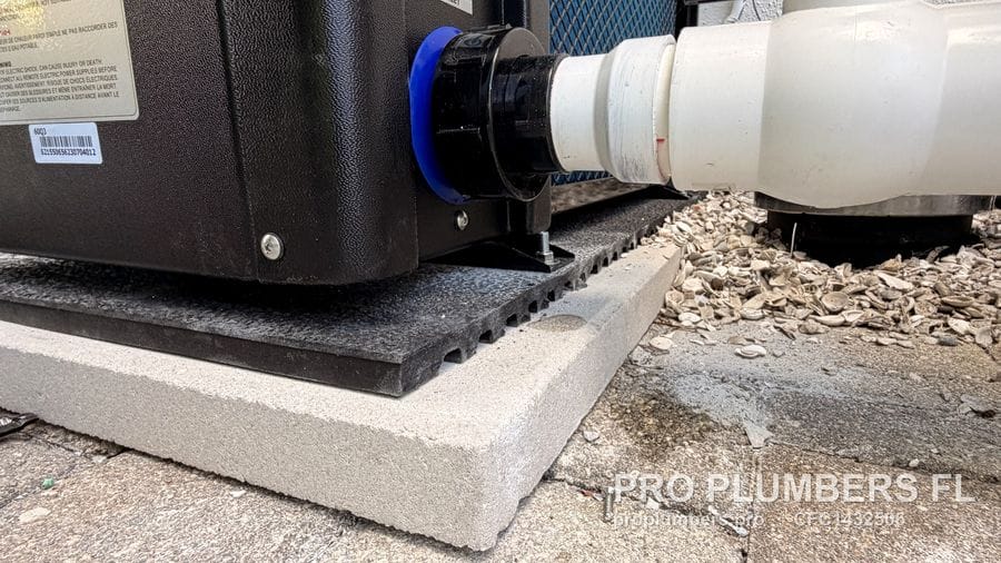 PVC union connection at the pool heat pump water inlet on its pad in Palm Harbor, Florida by PRO PLUMBERS FL, LLC (licence CFC1432506)