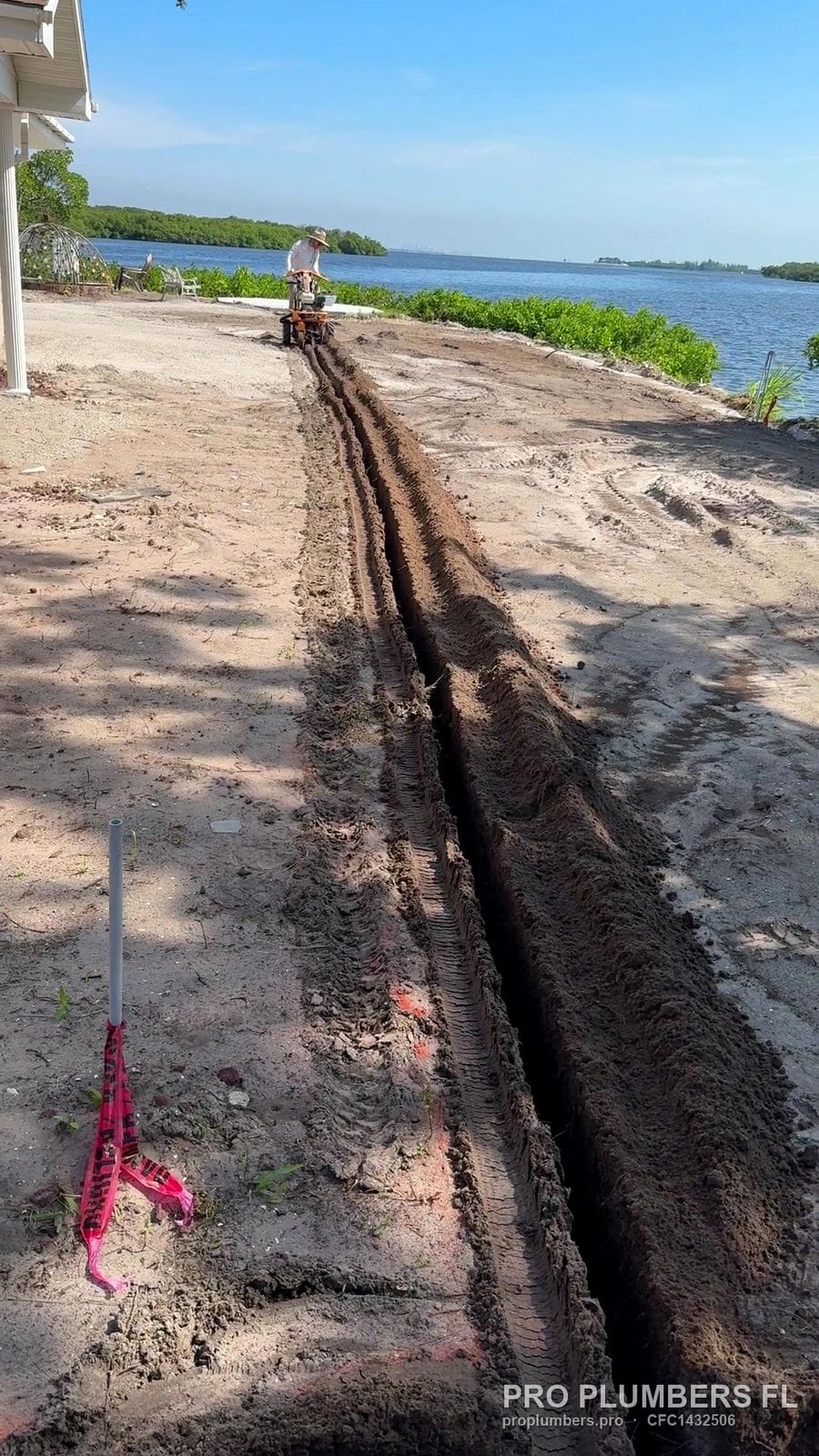 Irrigation trench running across a waterfront lot in Ruskin, Florida by PRO PLUMBERS FL, LLC (licence CFC1432506)