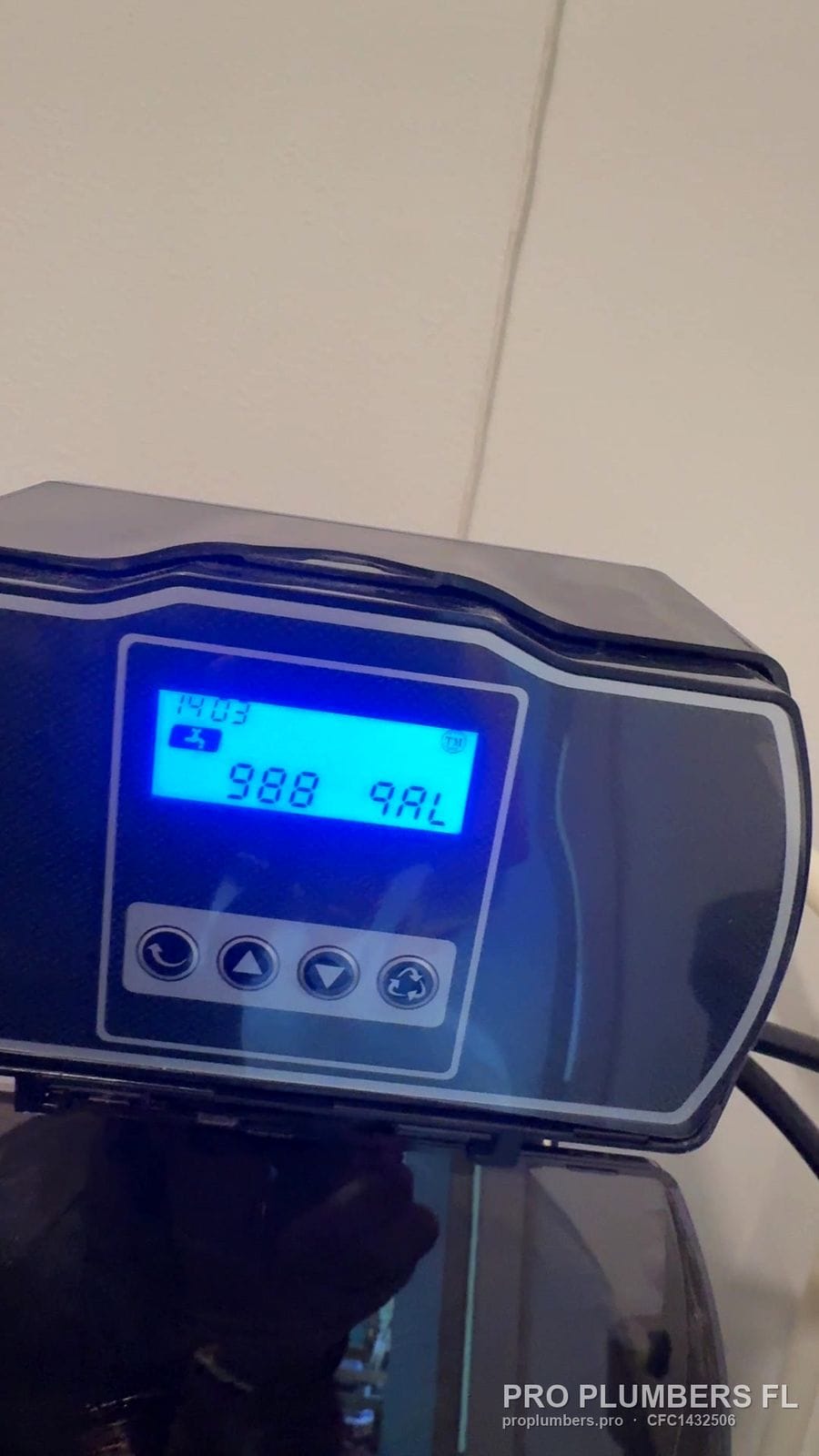 Lit digital control display of a water softener in Belleair, Florida by PRO PLUMBERS FL, LLC (licence CFC1432506)