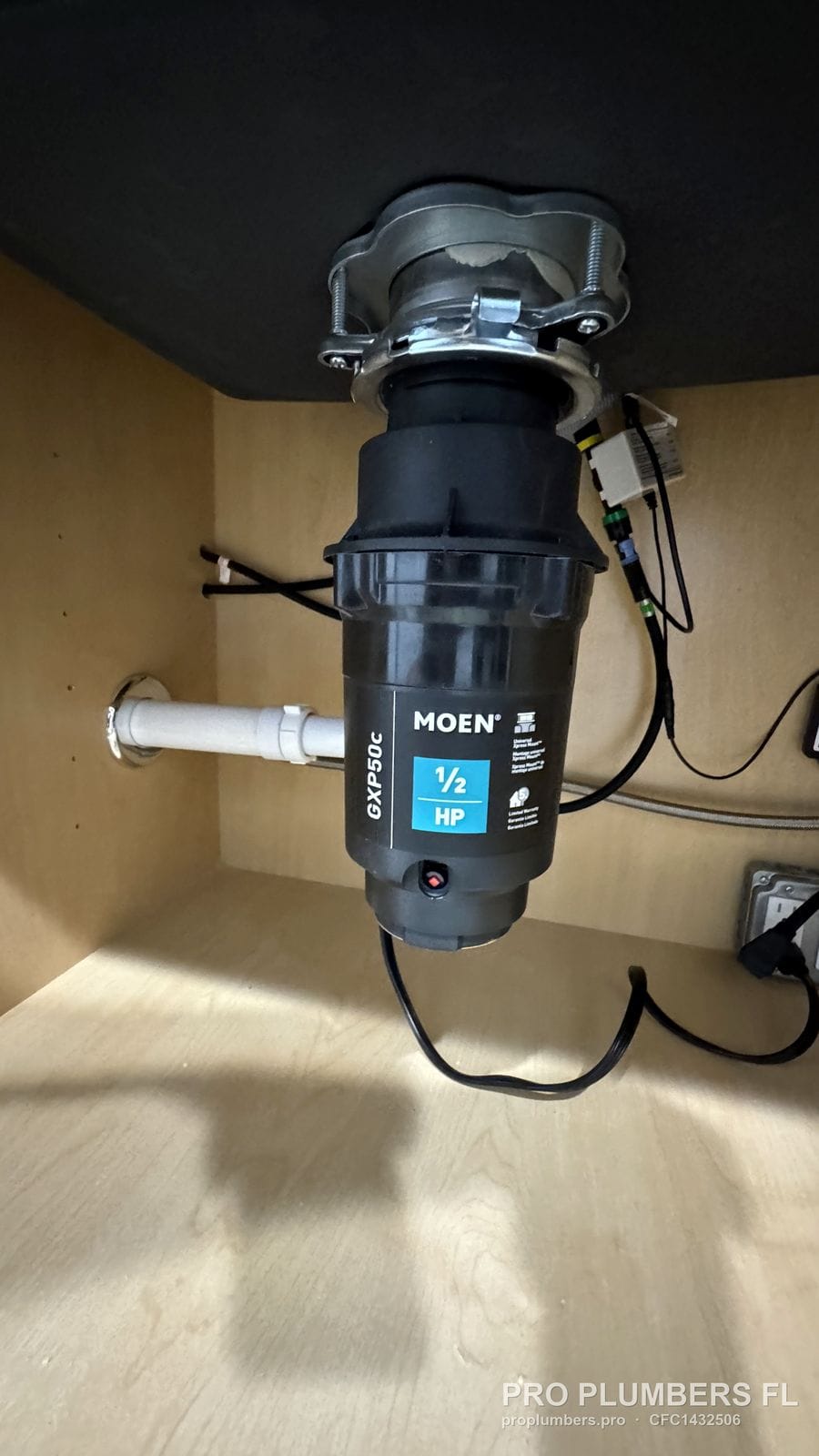 Moen GXP50C 1/2 HP disposal body and discharge connection in Clearwater, Florida by PRO PLUMBERS FL, LLC (licence CFC1432506)