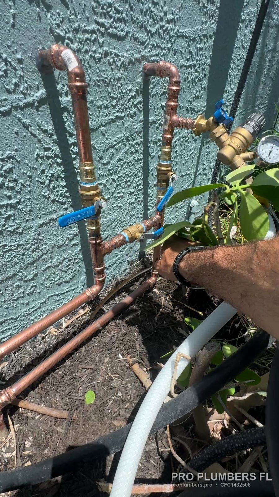 New copper water main with ball valves and pressure regulator at an exterior wall in South Pasadena, Florida by PRO PLUMBERS FL, LLC (licence CFC1432506)
