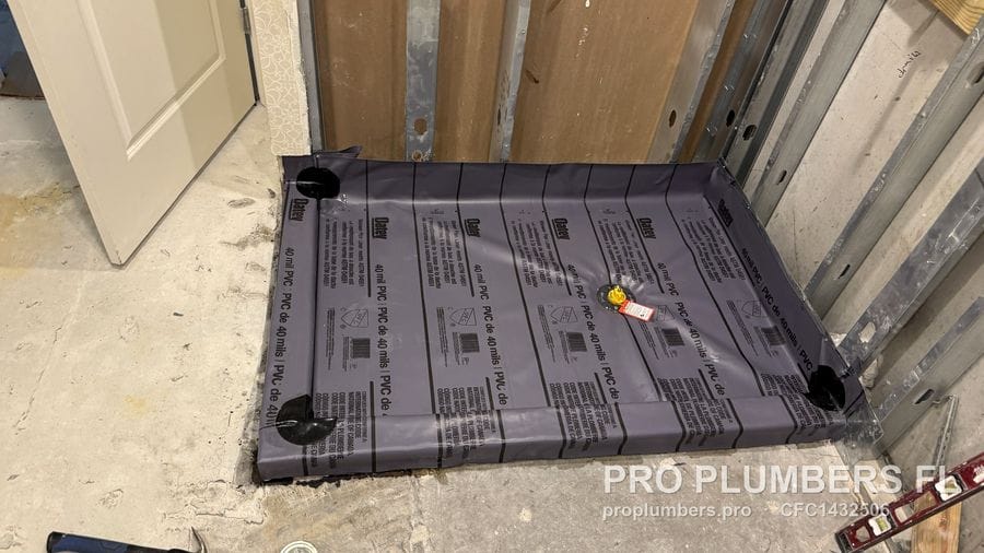 Oatey 40 mil PVC shower pan liner installed on a shower base with steel stud walls in Tampa, Florida by PRO PLUMBERS FL, LLC (licence CFC1432506)