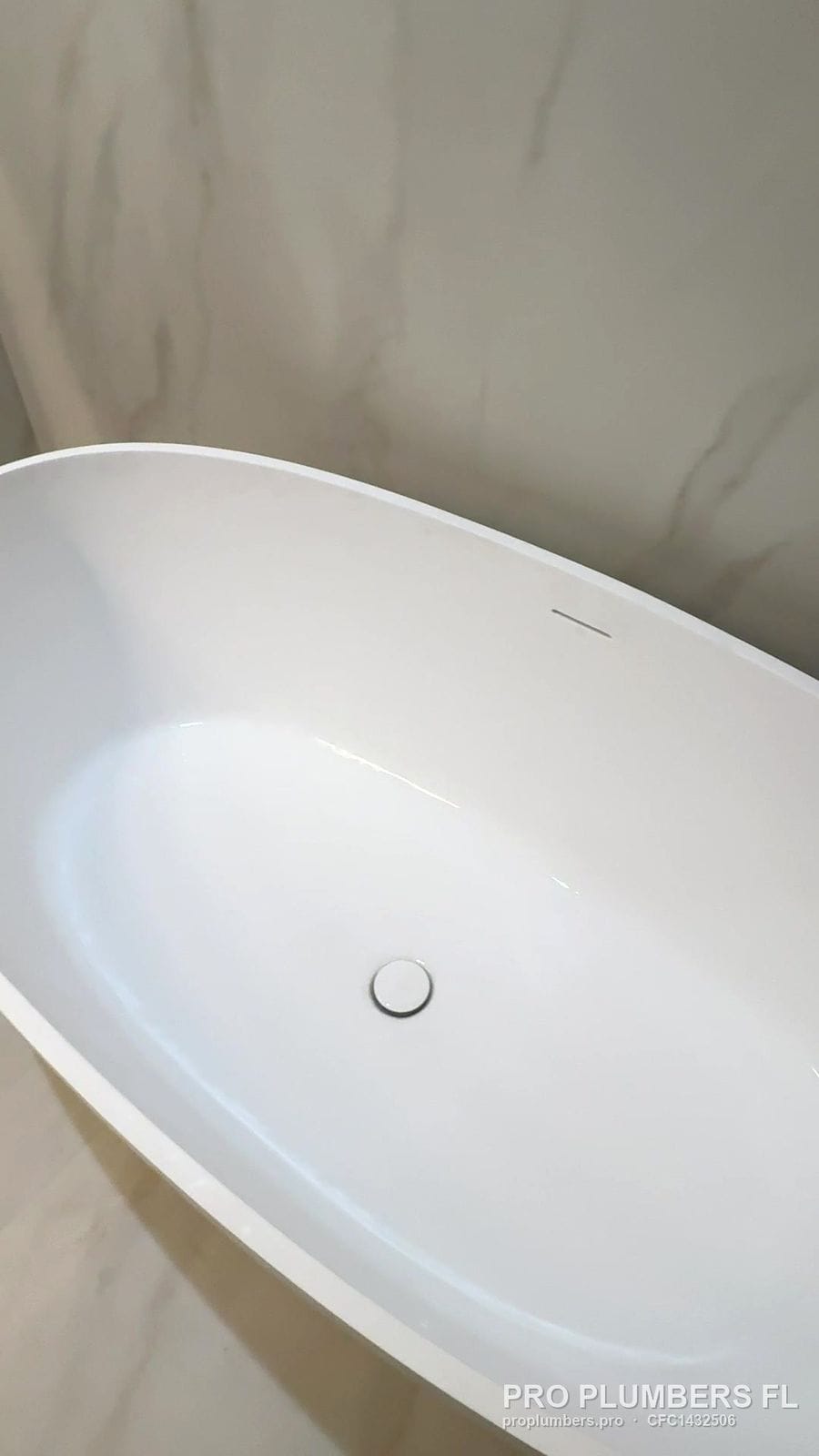 Oval freestanding tub interior with pop-up drain in Venice, Florida by PRO PLUMBERS FL, LLC (licence CFC1432506)