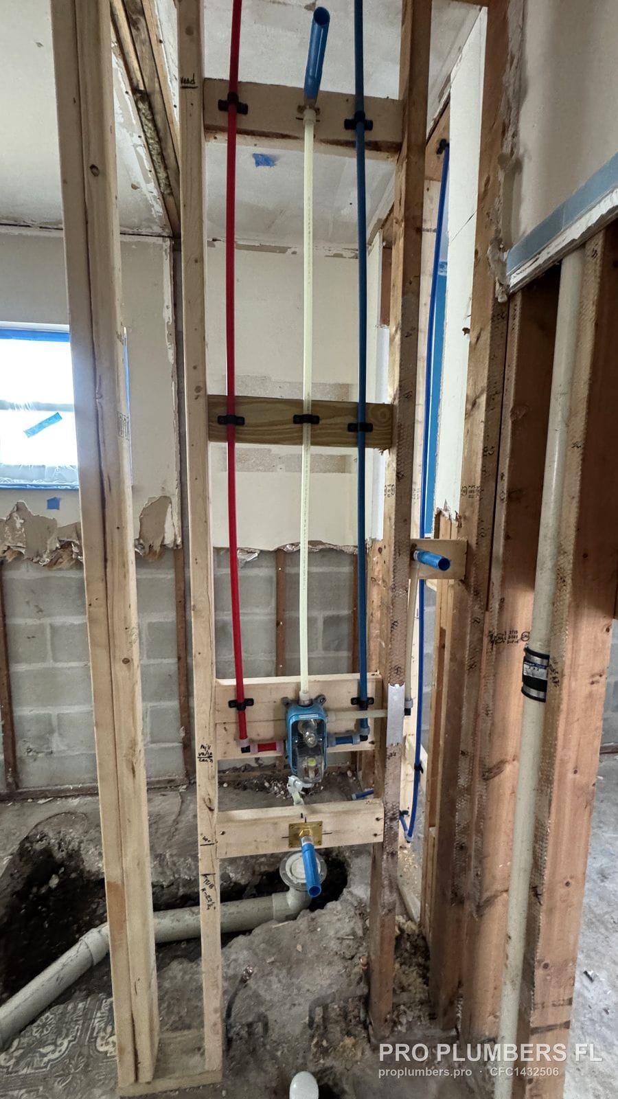 Shower rough-in with PEX-A piping during a bathroom remodel against a block wall in Belleair Beach, Florida by PRO PLUMBERS FL, LLC (licence CFC1432506)