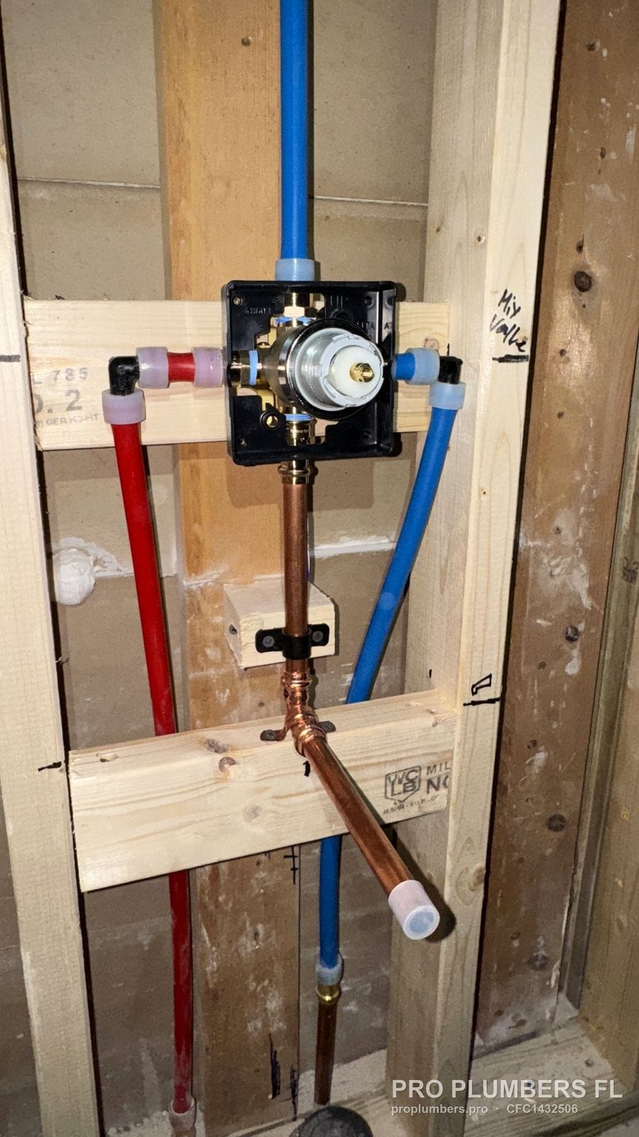 Shower valve with red and blue PEX-A supplies and a copper tub spout drop in St. Petersburg, Florida by PRO PLUMBERS FL, LLC (licence CFC1432506)