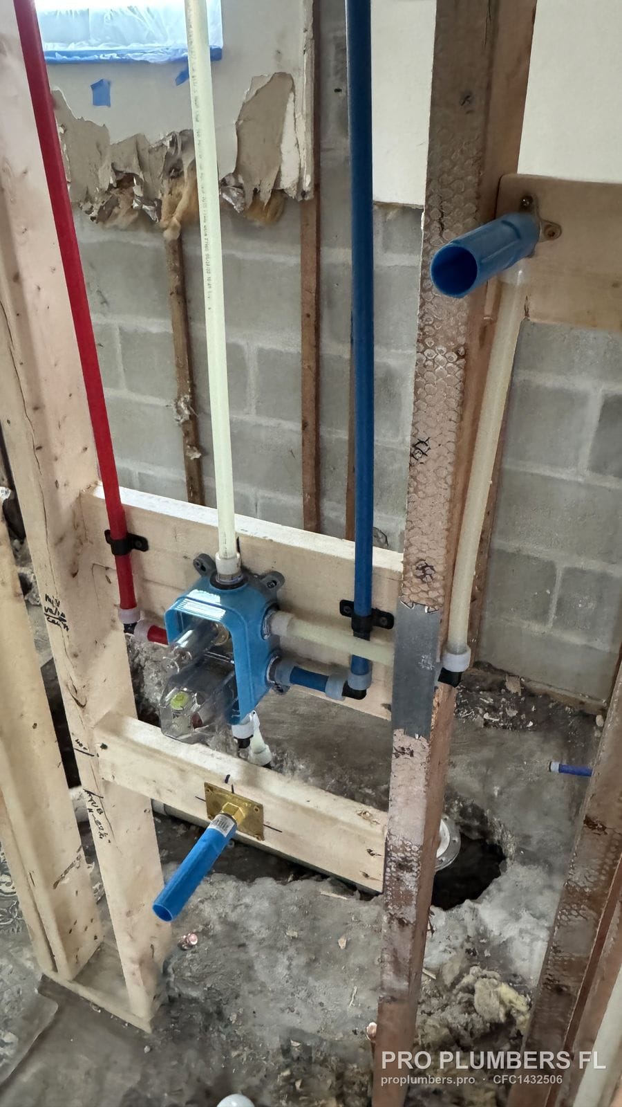 Shower valve with PEX-A lines above the new floor drain in a remodel in Belleair Beach, Florida by PRO PLUMBERS FL, LLC (licence CFC1432506)