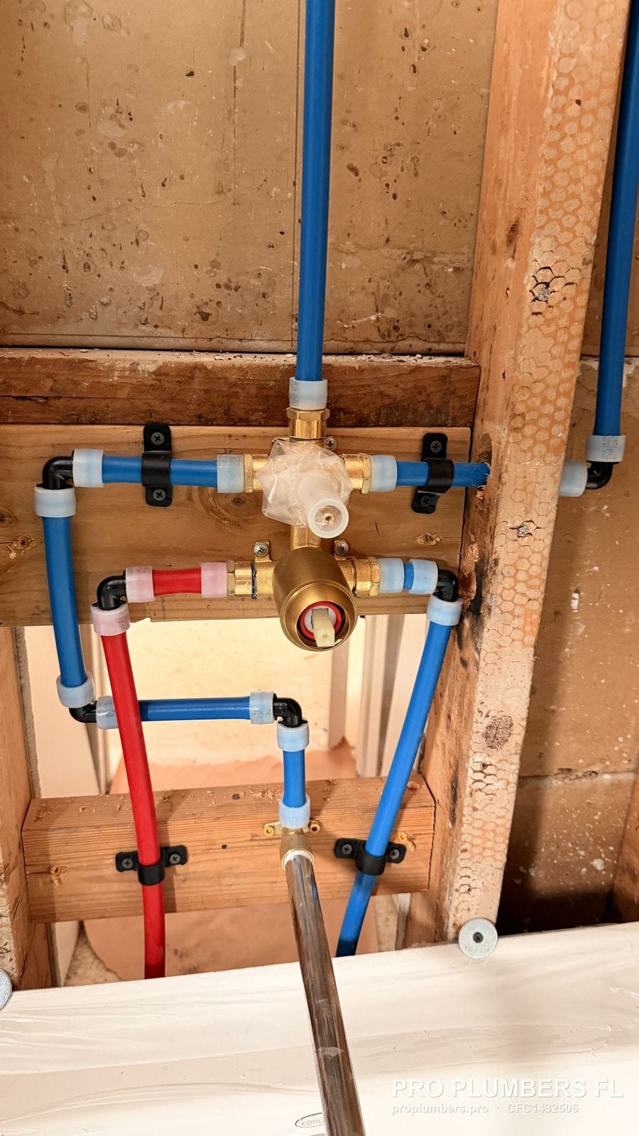 Brass tub and shower valve with PEX-A supply lines and a copper tub spout drop in Clearwater, Florida by PRO PLUMBERS FL, LLC (licence CFC1432506)
