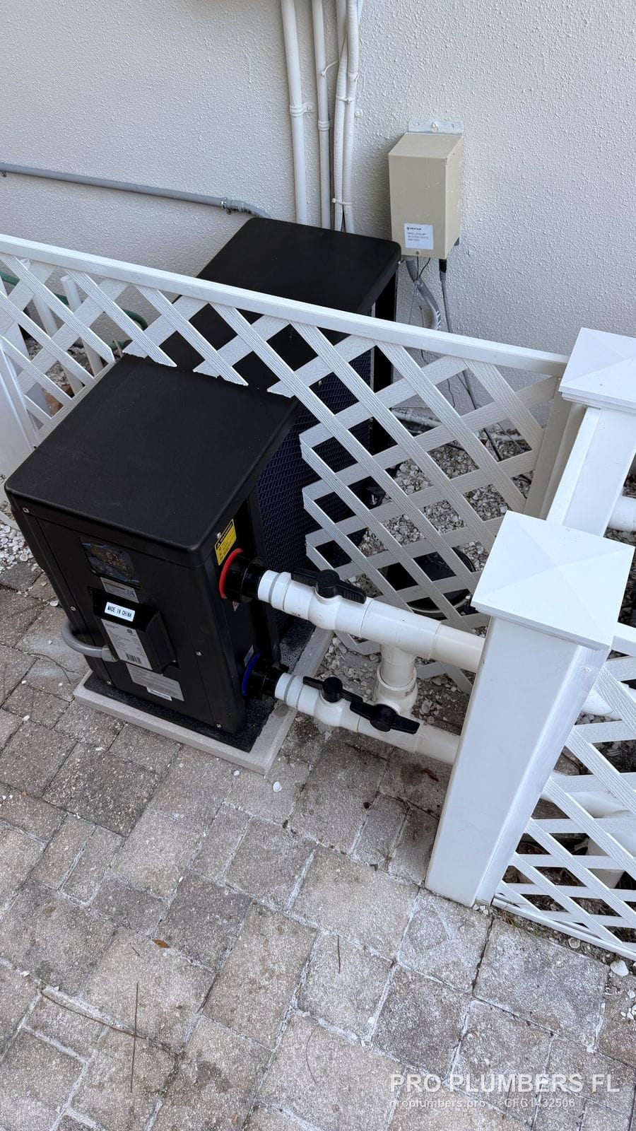 Overhead view of the finished pool heat pump installation and piping in Palm Harbor, Florida by PRO PLUMBERS FL, LLC (licence CFC1432506)