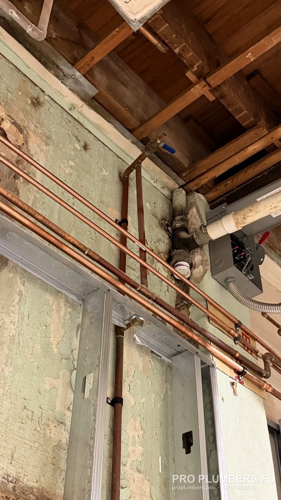 Copper water supply lines run overhead through the framing of a restaurant build-out in West Palm Beach, Florida by PRO PLUMBERS FL, LLC (licence CFC1432506)