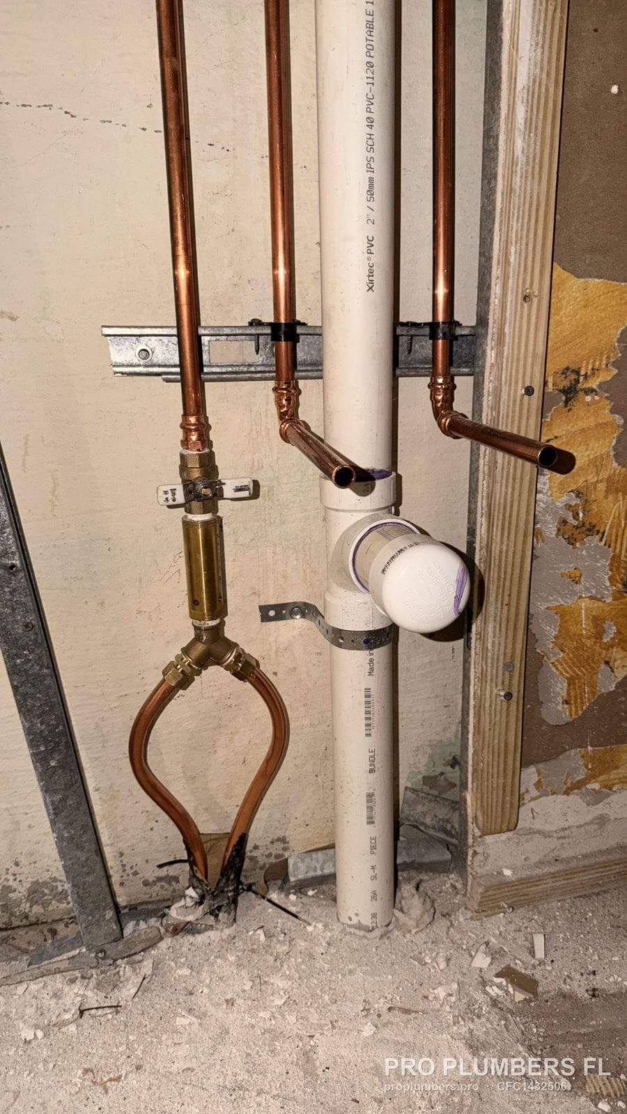 Press-fit copper water lines with a ball valve beside PVC drain stacks in a restaurant build-out in West Palm Beach, Florida by PRO PLUMBERS FL, LLC (licence CFC1432506)