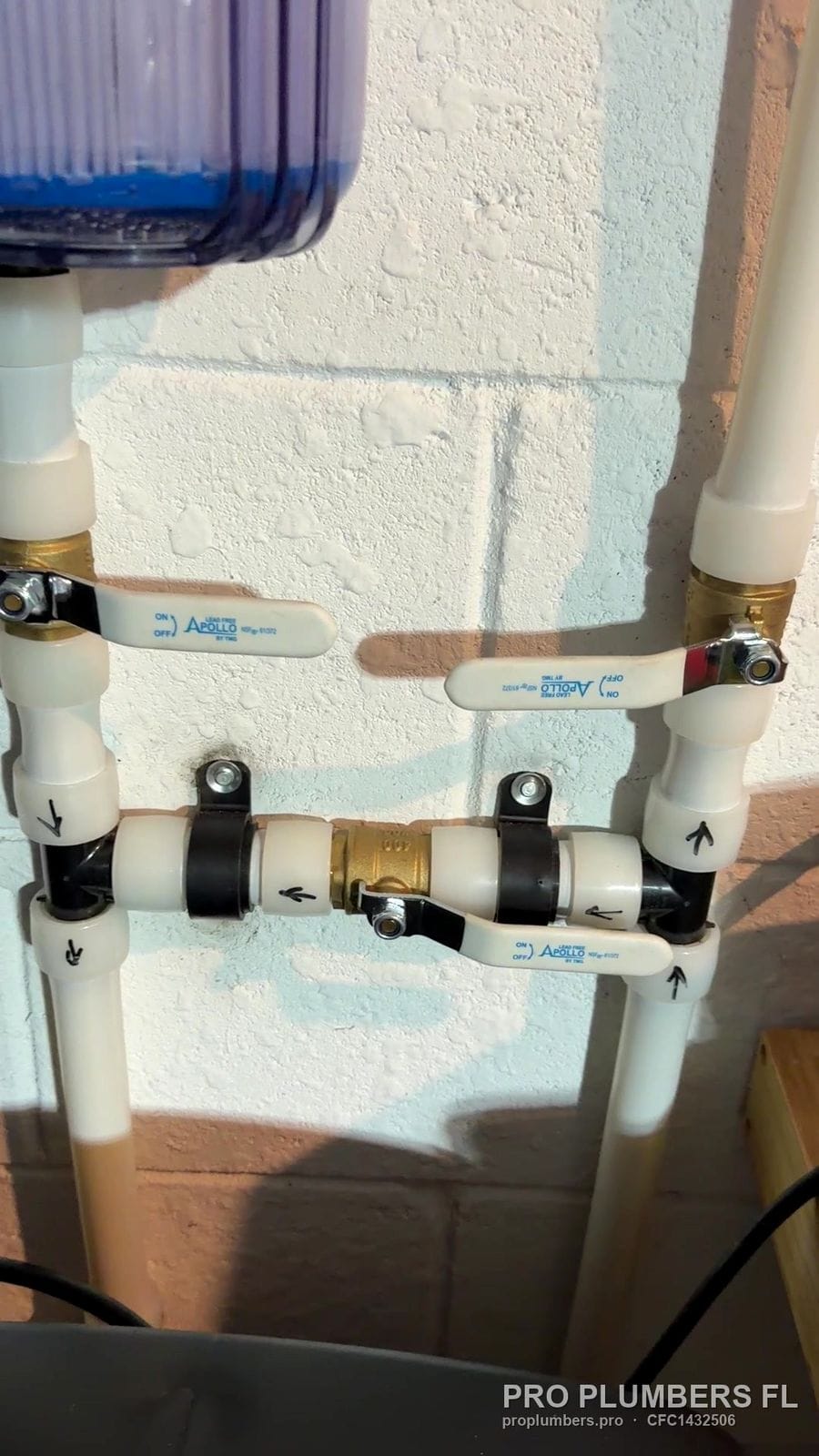 PVC bypass manifold with ball valves and brass unions under a whole-house filter in Bradenton, Florida by PRO PLUMBERS FL, LLC (licence CFC1432506)