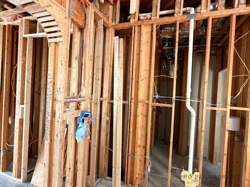 Whole-home repipe in progress, home opened to framing — Tampa, FL