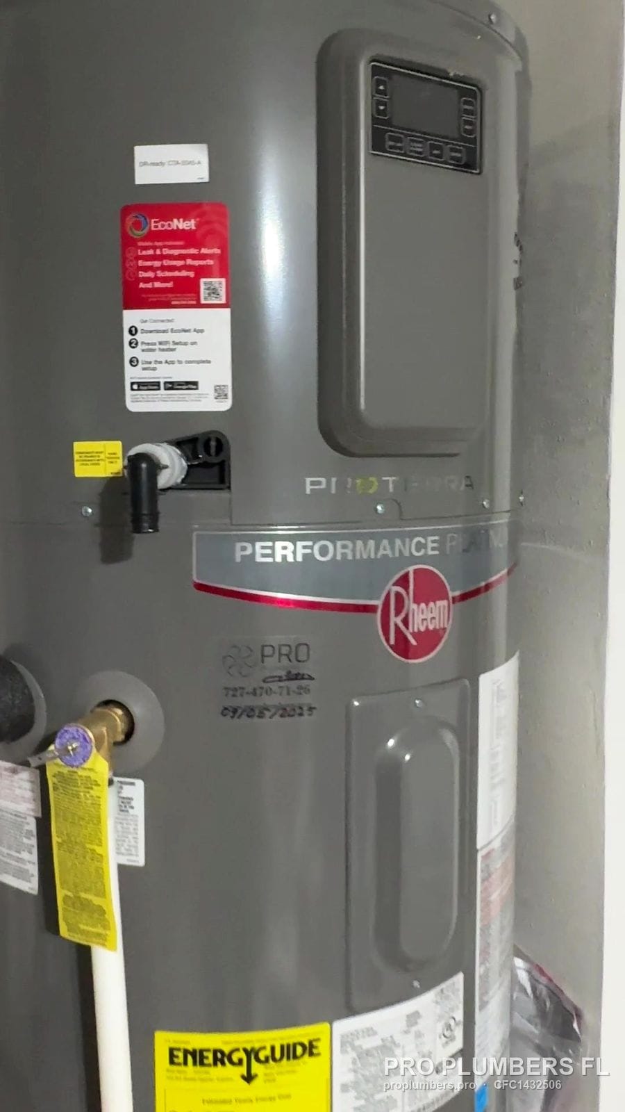 Rheem Performance Platinum heat pump water heater with EnergyGuide label in Belleair Beach, Florida by PRO PLUMBERS FL, LLC (licence CFC1432506)