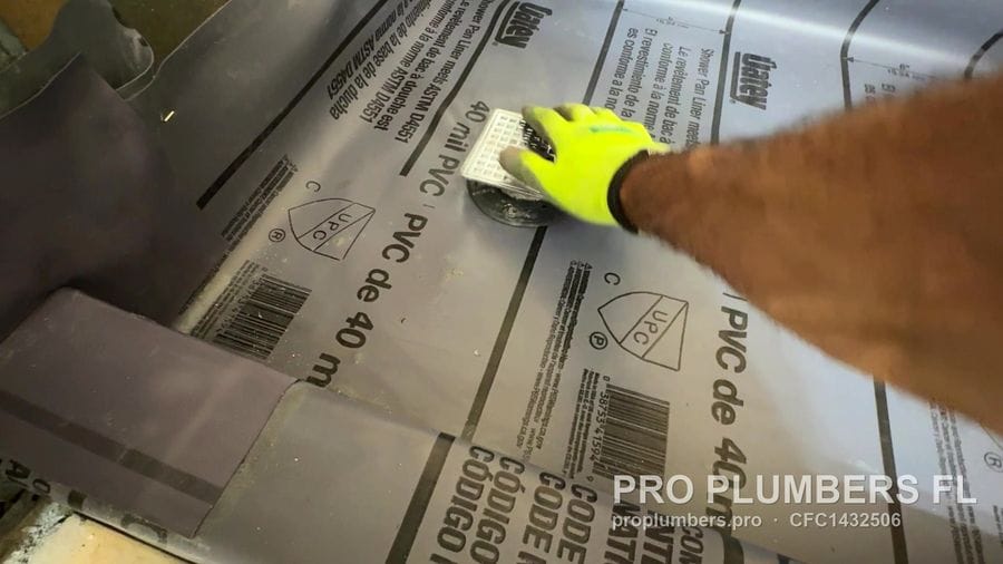 Shower pan liner at the drain with clamping ring in Indian Shores, Florida by PRO PLUMBERS FL, LLC (licence CFC1432506)