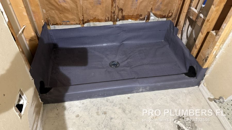 Shower pan liner with drain flange and corners ready for mortar bed in Sarasota, Florida by PRO PLUMBERS FL, LLC (licence CFC1432506)