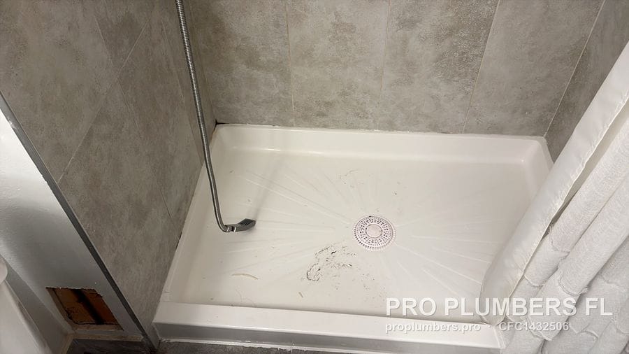 New shower base with center drain installed in Clearwater, Florida by PRO PLUMBERS FL, LLC (licence CFC1432506)