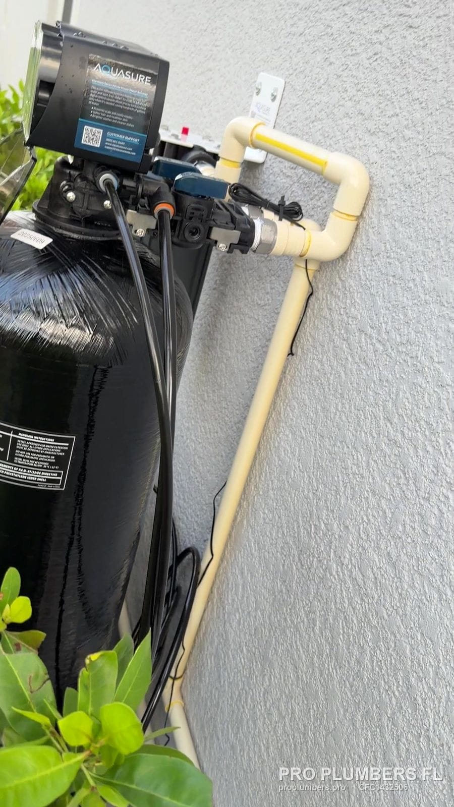 Softener control valve and CPVC bypass on a stucco wall in Sarasota, Florida by PRO PLUMBERS FL, LLC (licence CFC1432506)