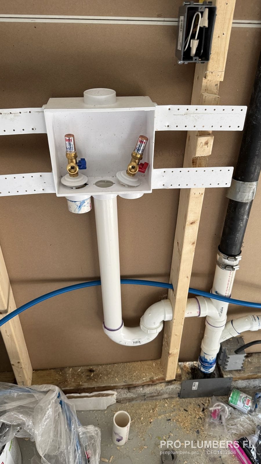 Washer outlet box with PVC trap and PEX supply lines in an open wall in Hudson, Florida by PRO PLUMBERS FL, LLC (licence CFC1432506)