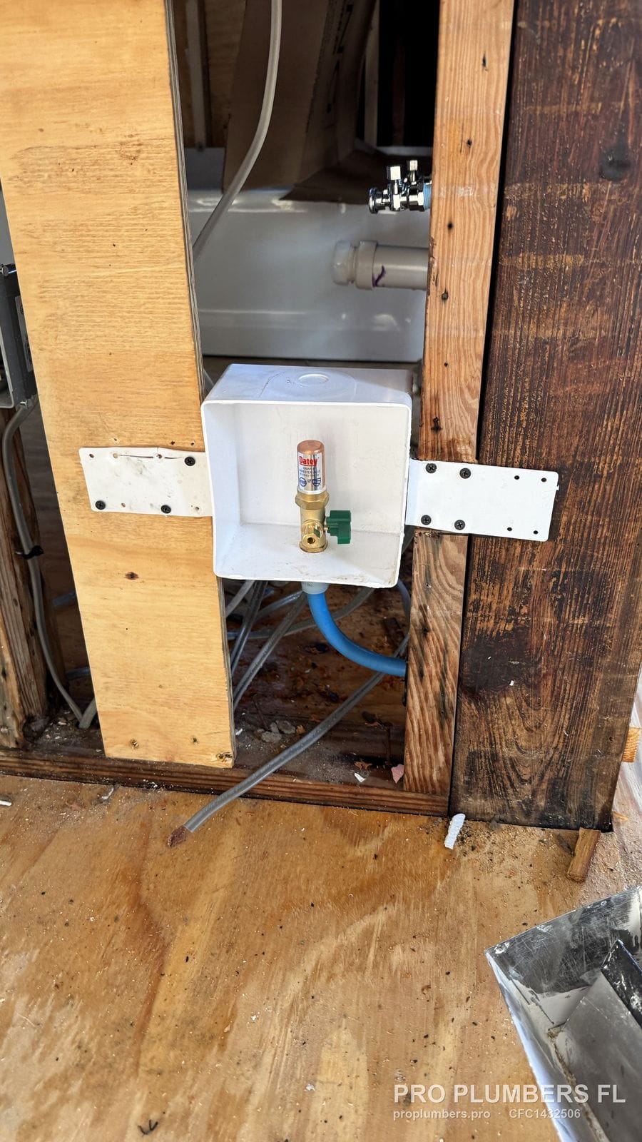Washer outlet box mounted on an adjustable bracket between studs in South Pasadena, Florida by PRO PLUMBERS FL, LLC (licence CFC1432506)