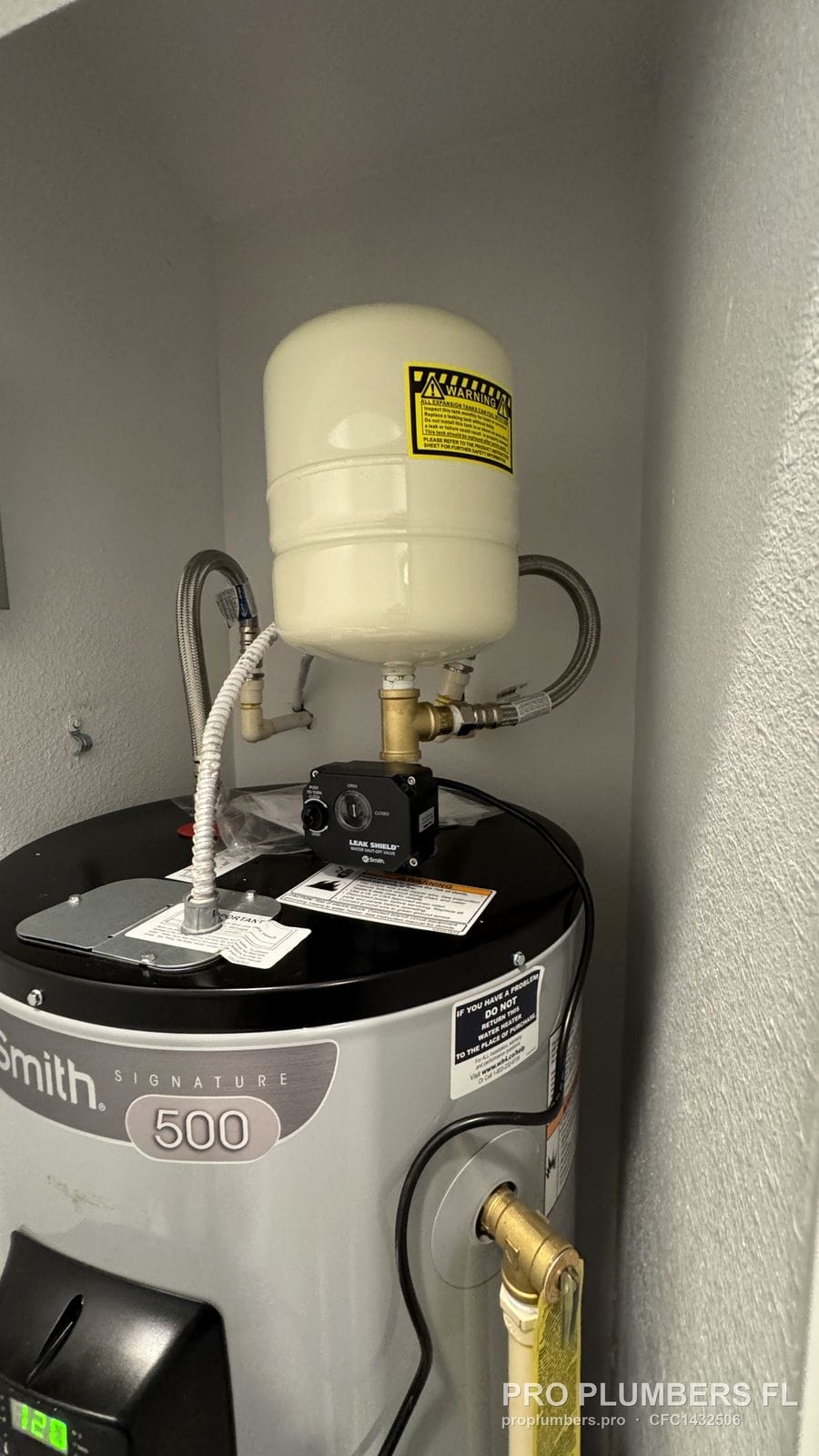 Thermal expansion tank mounted on the cold inlet of an electric tank water heater in Clearwater, Florida by PRO PLUMBERS FL, LLC (licence CFC1432506)