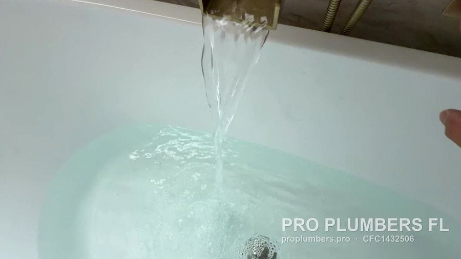 Waterfall spout filling a freestanding tub in Clearwater, Florida by PRO PLUMBERS FL, LLC (licence CFC1432506)