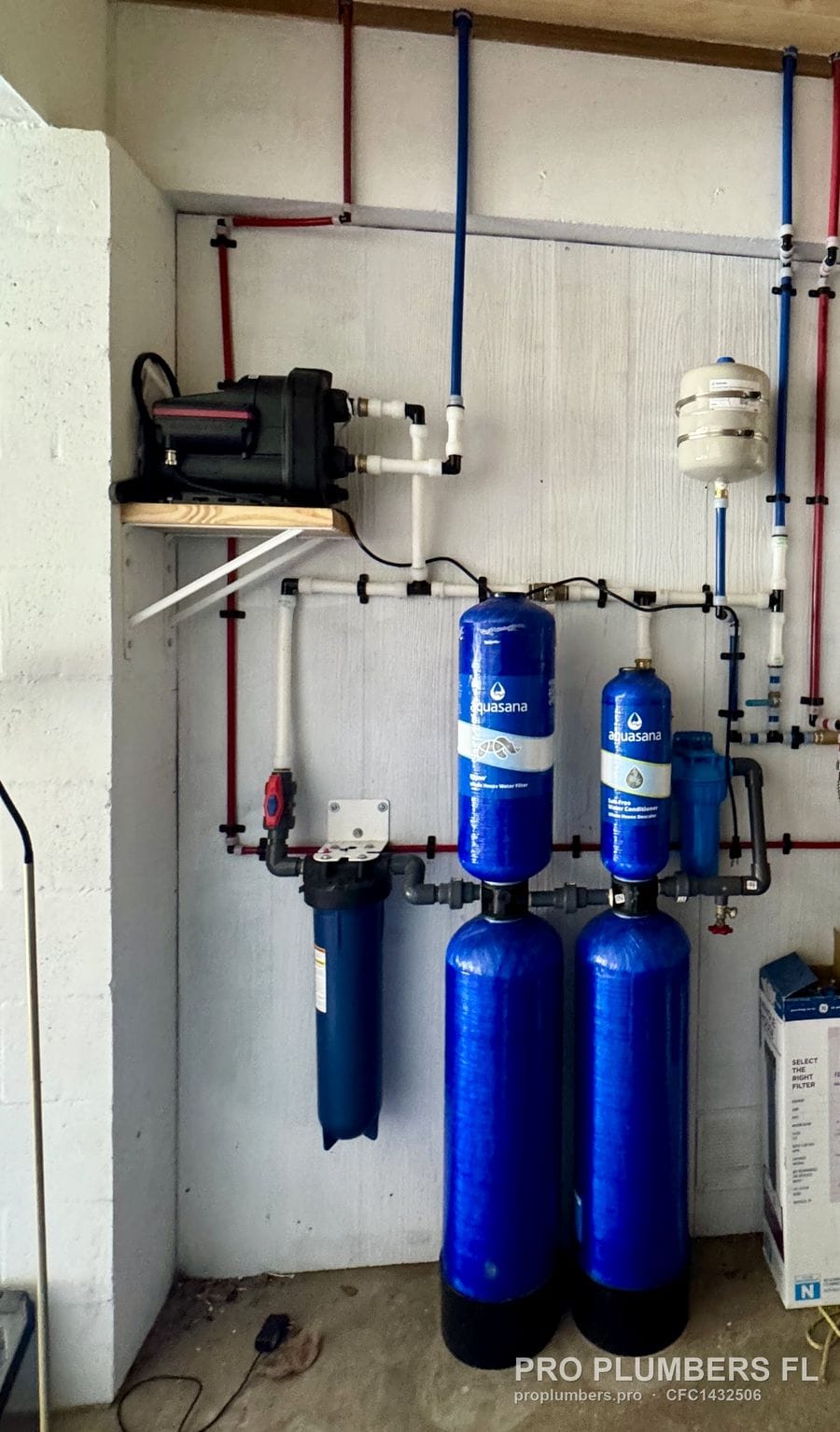 Aquasana two-tank system with booster pump, expansion tank, tankless water heater and PEX manifold in Englewood, Florida by PRO PLUMBERS FL, LLC (licence CFC1432506)