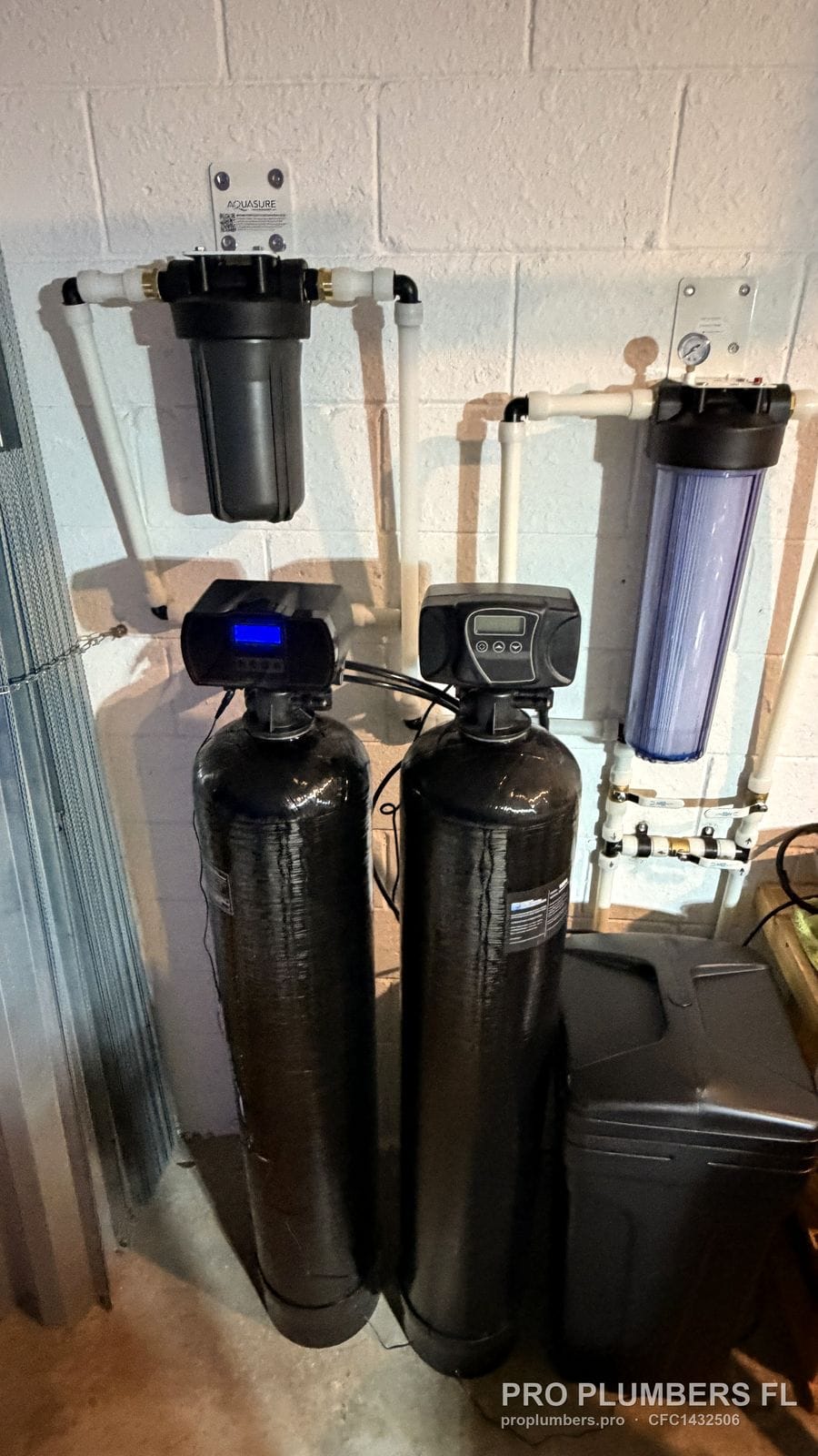 Closer view of the two-tank softener and filter system with CPVC and brass valves in Bradenton, Florida by PRO PLUMBERS FL, LLC (licence CFC1432506)